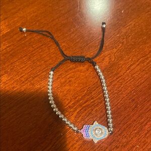 Beautiful silver bracelet with adjustable string closure